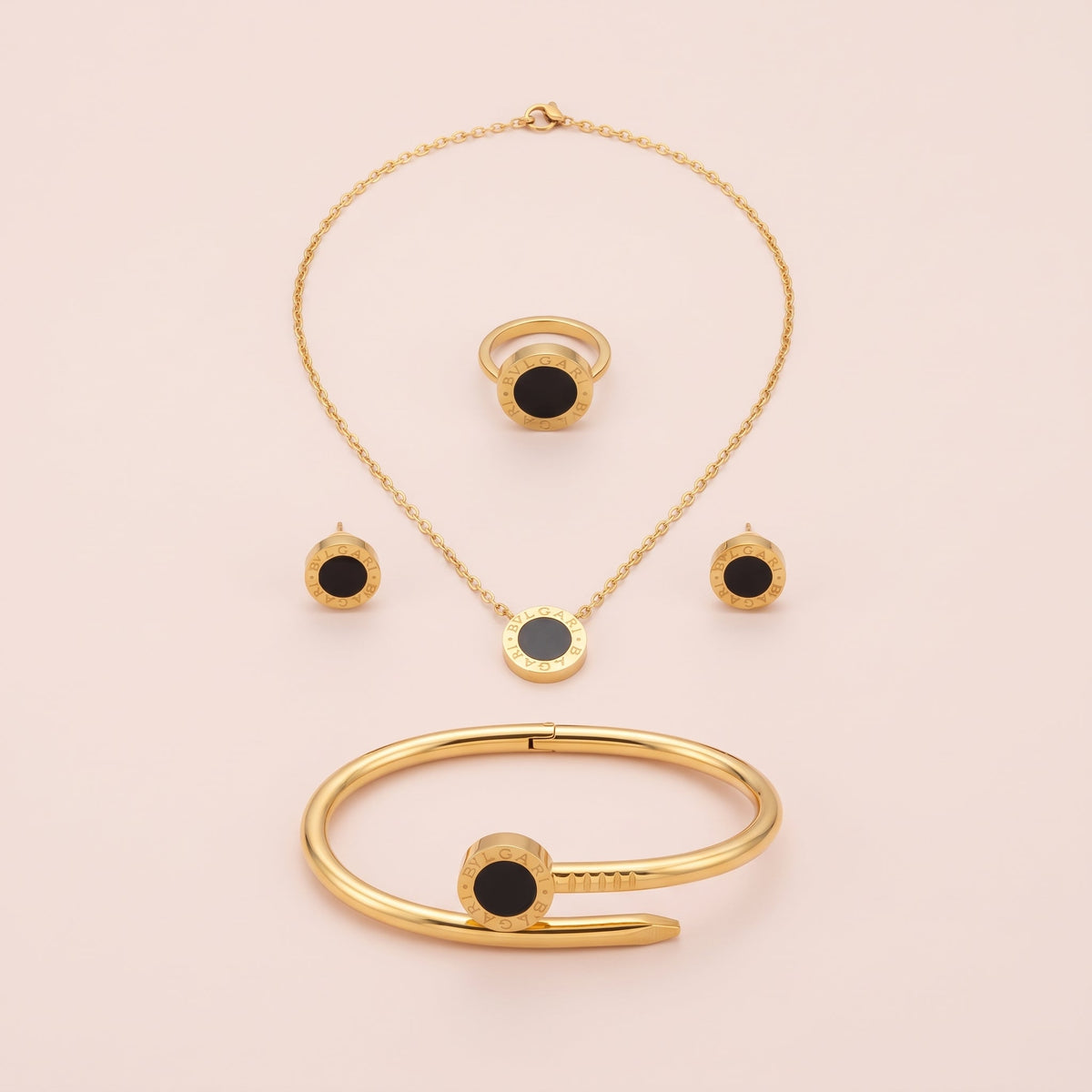 NoorPosh.pk Premium Black & Gold Stainless Steel Complete Jewelry Set – Luxury Necklace, Ear Studs, Ring & Hand Cuff
